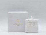 an image of a white box with a pair of earrings in it