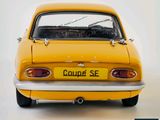 a small yellow car with a license plate on the back of it