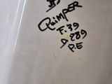 a close up of a toilet with graffiti on it