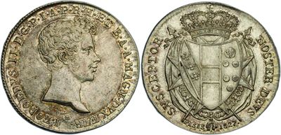 a silver coin with a crown on top of it
