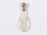 an image of a silver spoon with a clear liquid inside of it