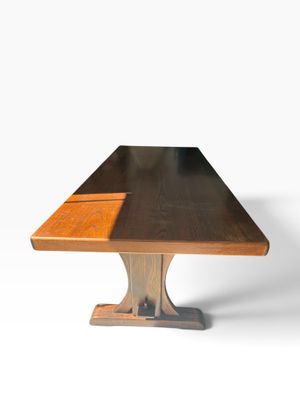 an image of a wooden table with a black top and a brown base
