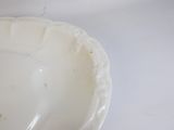 a white paper plate with some food in it