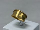 an image of a gold ring sitting on top of a white cube
