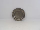 silver plate sitting on a white surface with a white background
