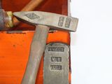 two hammers that are next to each other on a box