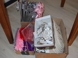 a box full of scissors and other items sitting on the floor