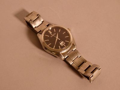 a watch that is laying on a table