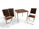 three chairs and a table on a white background