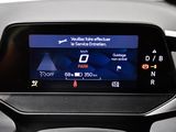 the dashboard of a car with a digital display in the center
