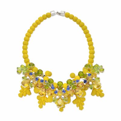 a close up of a necklace on a white background