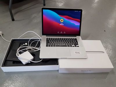 a laptop computer sitting in a box on the floor