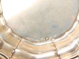 a silver plate that is sitting on top of a table