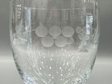 a wine glass that is sitting on a table