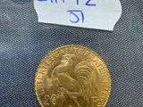 a close up of a gold coin with a label on it