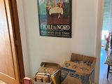 many boxes of books stacked on the floor in this room