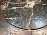 a marble table top with a circular design on it