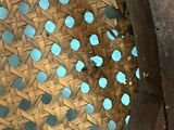 a close up of a basket with blue dots on it