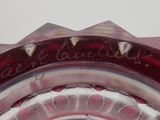 a close up picture of a glass vase with writing on it