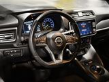 dashboard of a car with a steering wheel and dashboard controls