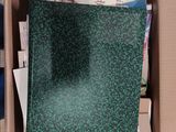 a box with a green cloth inside of it