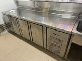 a large stainless steel counter in a commercial kitchen