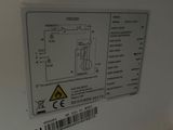 a close up of a white refrigerator with a label on it