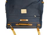the back of a blue bag with a brown strap on it