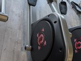 a row of stationary exercise bikes in a gym