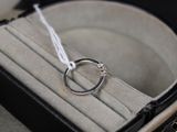 a ring in a case with a string in it