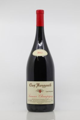 the bottle of red wine is sitting on the table