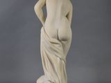 an image of a statue of a woman with her back to the camera