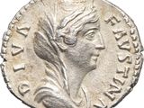 a silver coin with an image of a woman wearing a headdress