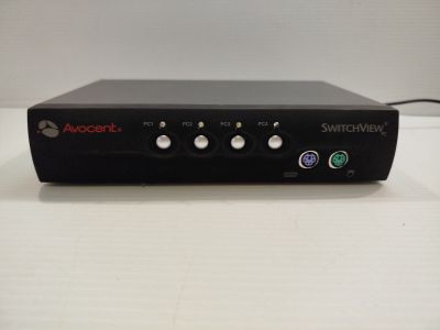 a close up of a black device on a white surface