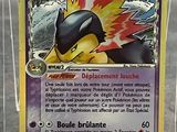a close up of a pokemon card in a display case