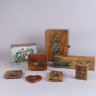 several pieces of art are displayed on a white surface