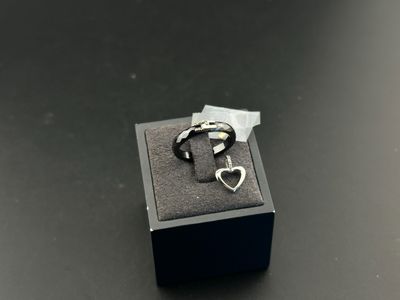 a black box with a silver ring inside of it