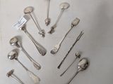 a lot of silver spoons and forks arranged in a circle