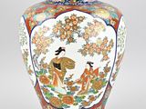 a vase that has a picture of a woman on it