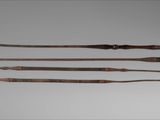 three different types of weapons are displayed on a gray surface