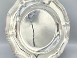 a silver plate that is sitting on a table