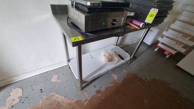 a microwave sitting on top of a shelf in a room