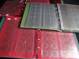 several binders are lined up on top of each other on a table