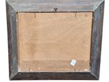 an old picture frame with a piece of wood in it