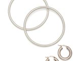 a pair of silver hoop earrings and a pair of silver hoop earrings