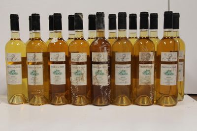 six bottles of wine are lined up in a row on a table