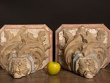 two decorative bookends with a yellow apple on the table