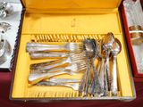 a box with silverware in it on a table