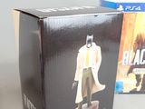 batman the dark knight action figure in a box next to a box with the box open