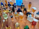many different types of perfume bottles on the table